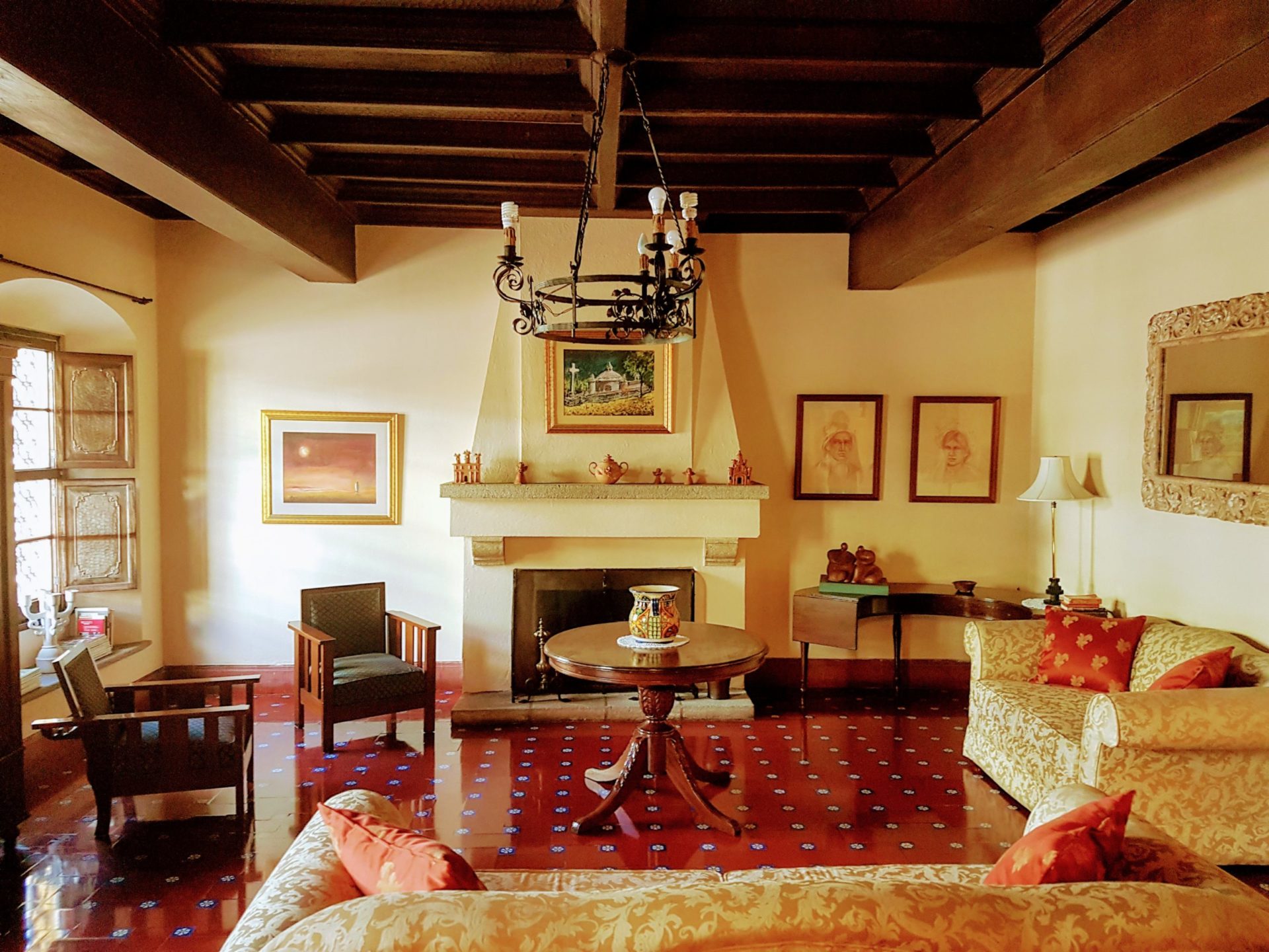 Casa Carmel colonial living room with fireplace